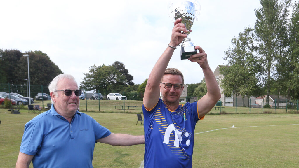Micky Barron lifts the Trophy